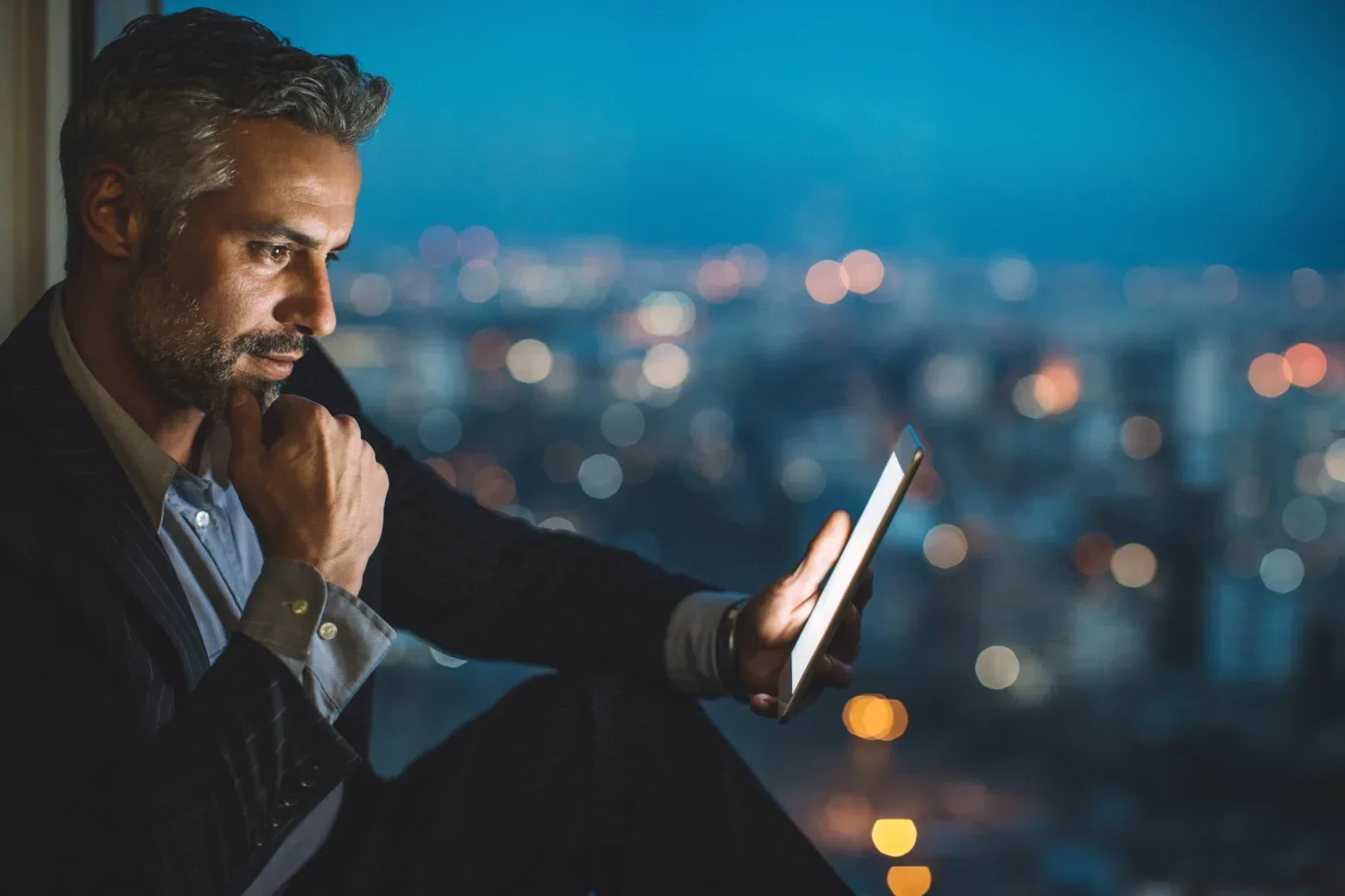 Man looking at his tablet